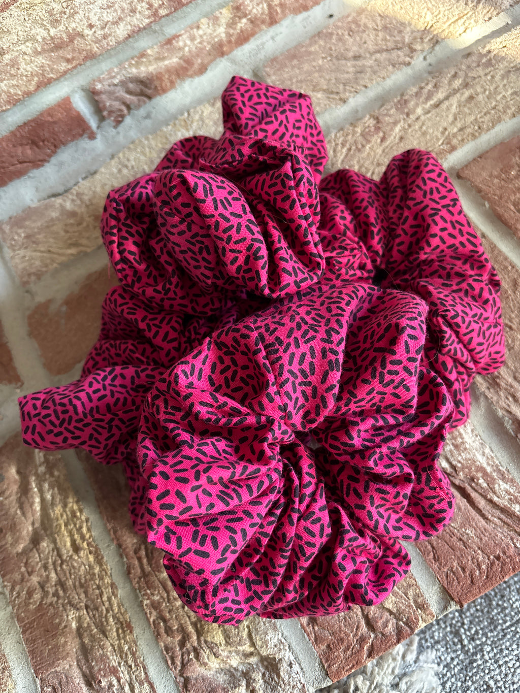 The Pink Confetti Jumbo Scrunchie: Highlights the speckled pattern.