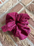 The Pink Confetti Jumbo Scrunchie: Highlights the speckled pattern.